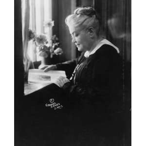  1916 photo Miss Laura Clay seated at desk reading,