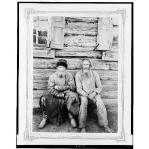   seated, outside of log house, full length, Russia 1895