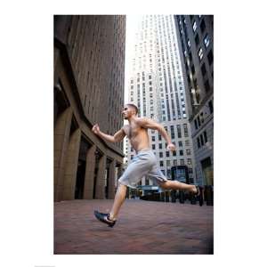   young man running in a city Poster (18.00 x 24.00): Home & Kitchen