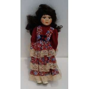   Painted Porcelain Doll; With Red Flower Print Dress; Dark Brown Hair