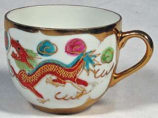 Asian Dragon Plate with four matching Dragon Teacups  