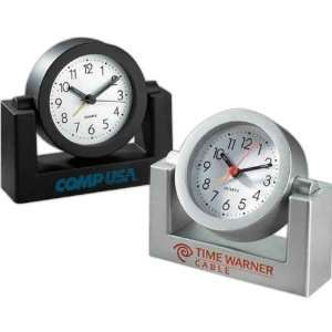   Tilting plastic alarm clock with battery included but not inserted